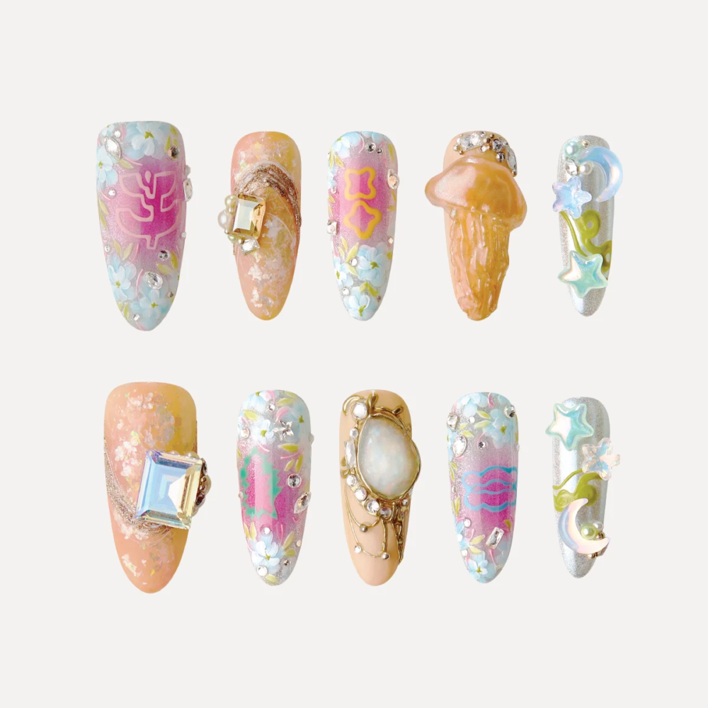A Splash of Pop press-on nails featuring pastel colors, 3D charms, gemstones, and playful sculptural designs.