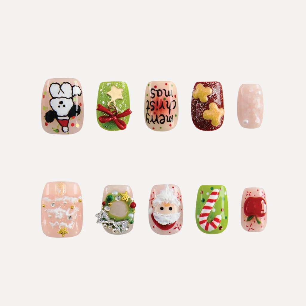 latlay of Christmas-themed short square press-on nail set featuring Santa Claus, wreath, gingerbread cookies, candy cane, gift bow, puppy illustration, and festive glitter accents.