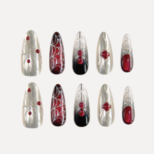 Flat-lay display of the “Crimson Whisper” long oval press-on nail set featuring silver chrome textures, red gem accents, and black-red gradient spiderweb designs.