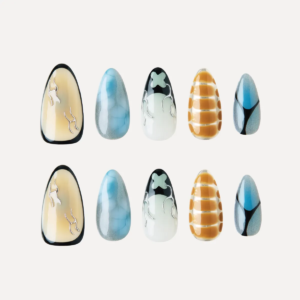 Flat lay of Deconstruct Vision press-on nail tips featuring abstract lines, smoky blue textures, yellow grid print, and black-white flame motifs