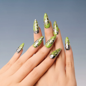 Hands wearing green and chrome zigzag pattern press-on nails in medium stiletto shape