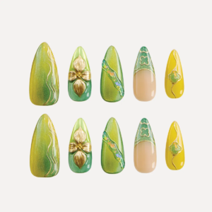 Flat lay of 10-piece Jade Gleam press-on nail set in green, gold, and yellow with 3D details