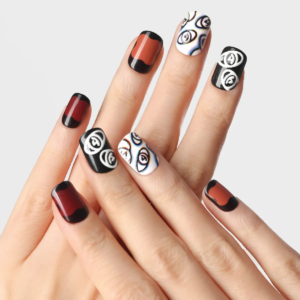 lost in park press-on nails in deep red and black tones with abstract white eye illustrations and gradient effects on fingers.