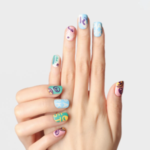 Front-facing hand pose highlighting the LOST in PARK text and graphic nail art from Riotous Paradise