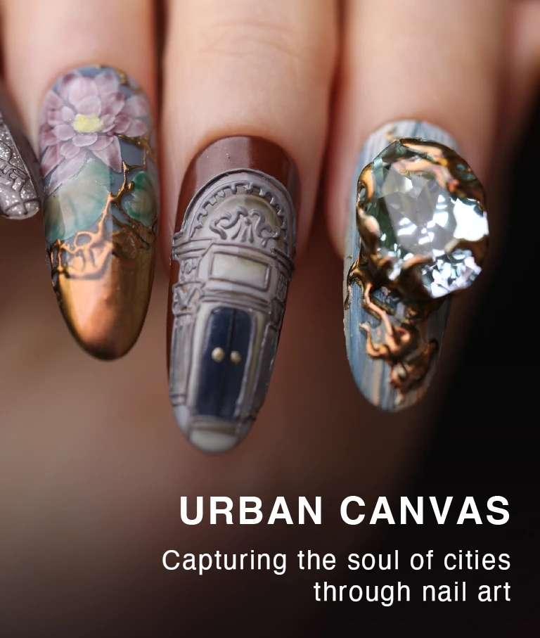 Close-up of vintage-inspired 3D press-on nails with floral painting, architectural carving, and a large gemstone embellishment.