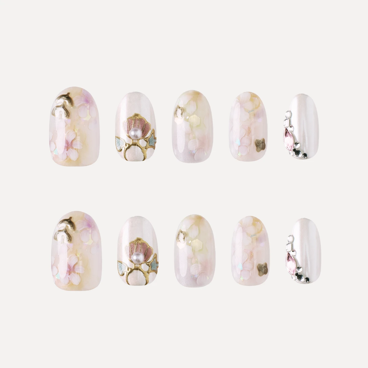 Short oval press on nail design set with floral and pearl details