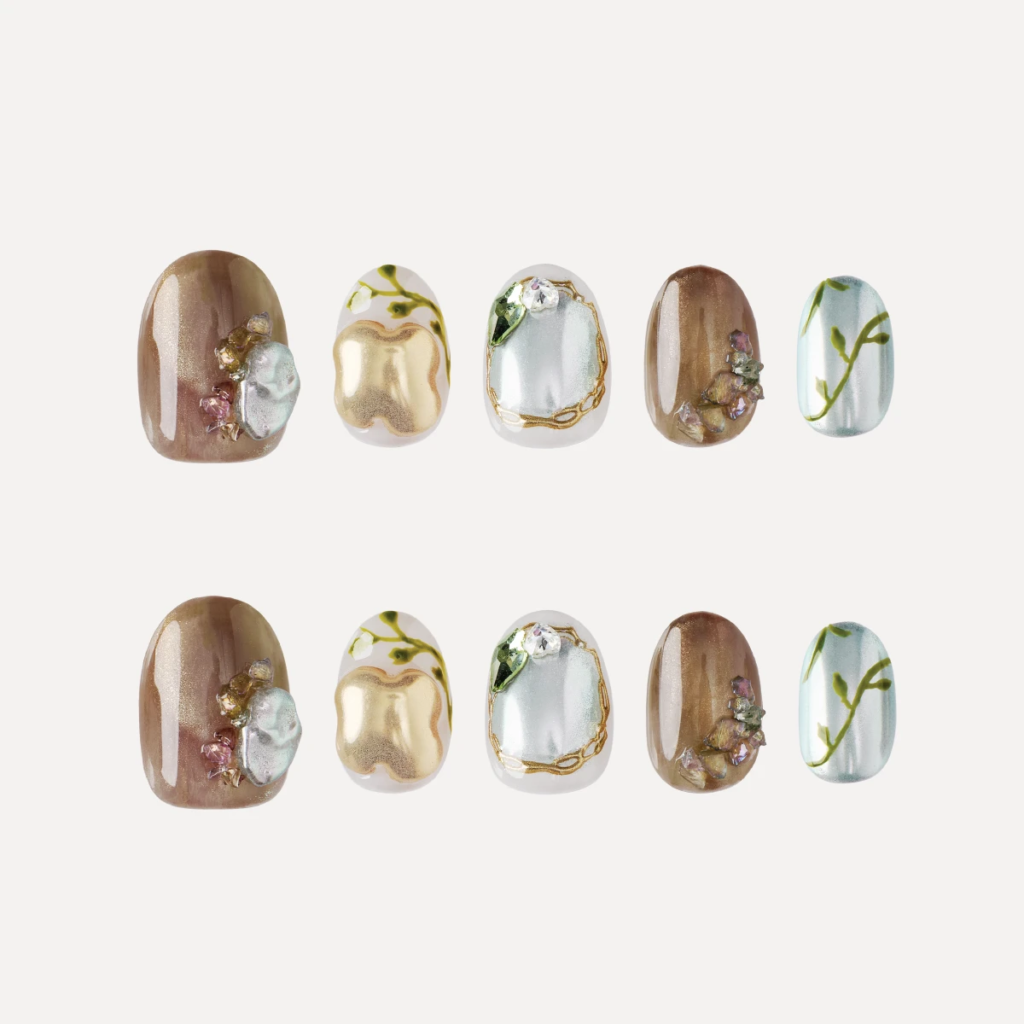 Short round press-on nail set with green, gold and translucent designs